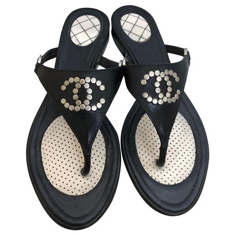 black girl in chanel slides|Chanel black flip flops.